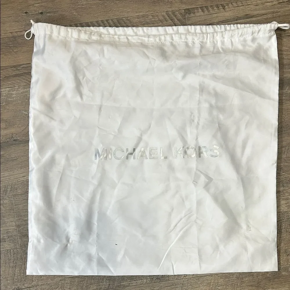 A13 | Michael Kors white dust jacket